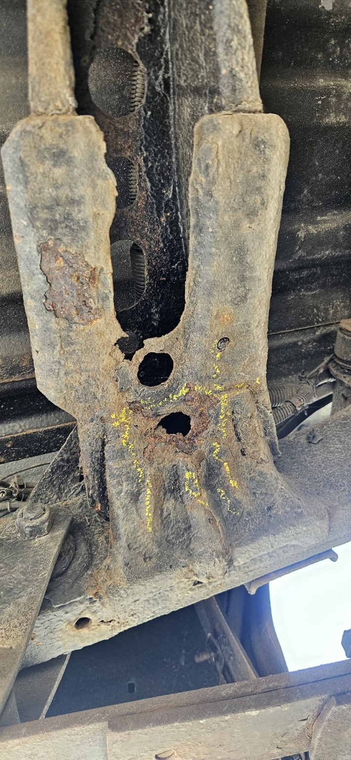 Perforated structural bracket / crossmember area